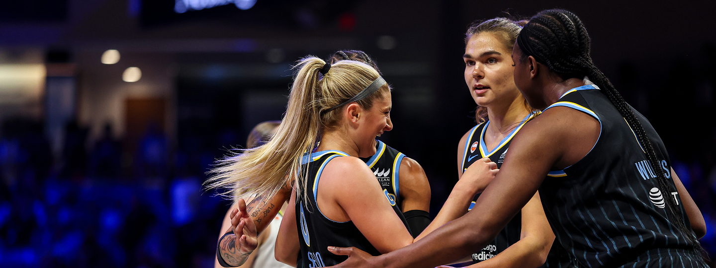 Two WNBA players playing basketball